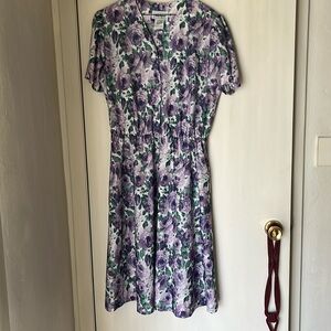 Polyester dress with elastic waist. Front buttons to waist. 14